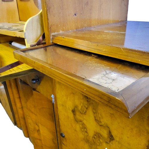 467 - An Art Deco walnut cocktail cabinet sideboard, hinged front opens revealing peach coloured mirror in... 