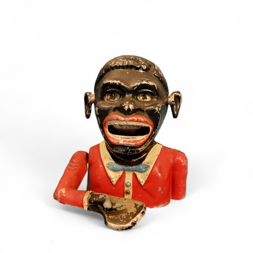 17 - An early 20th century aluminium Jolly Black Man money bank, 15cm high