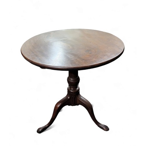 480 - A George III mahogany one piece tilt top table, turned supports, tripod base, pad feet.72cm high, 71... 