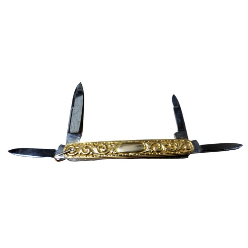 220A - A 19th century gold coloured metal multi-tool pen knife, chased with scrolling foliage, 8cm over loo... 