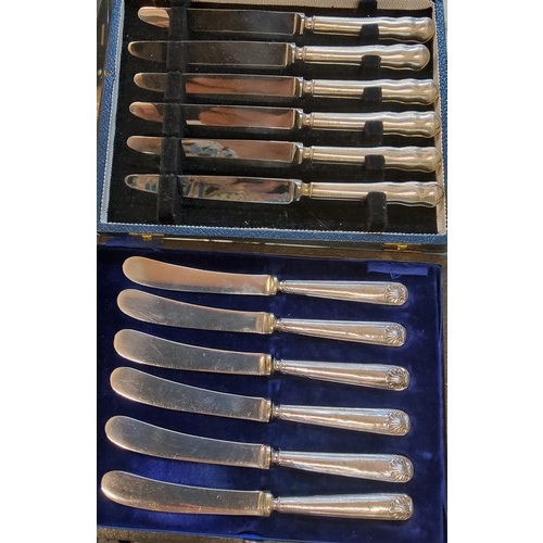 98 - A  set of six silver hafted dessert knives, Sheffield 1964;  a set of six butter knives, a... 