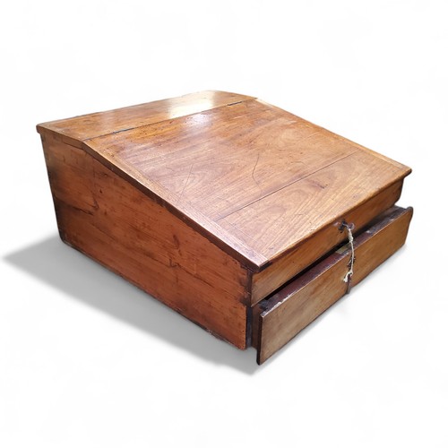 4 - A substantial Victorian mahogany and pitch pine writing slope, the hinged writing surface revealing ... 