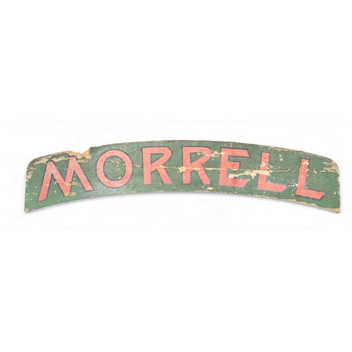 22 - Advertising - an early 20th century sign written arched wooden sign,  'Morrell',  painted in red and... 