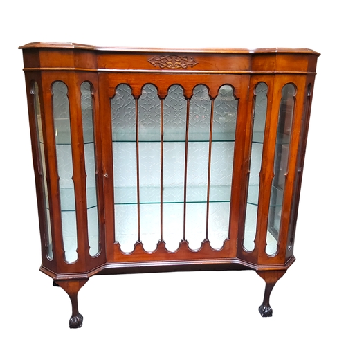 31 - A late Victorian walnut and mahogany Gothic Revival display cabinet, raised on cabriole legs termina... 