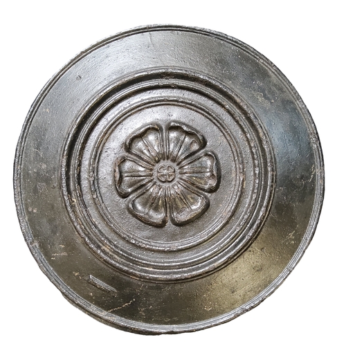 88 - A Victorian cast iron port hole or drain cover, embossed in relief with Yorkshire rose motif, 45cm d... 