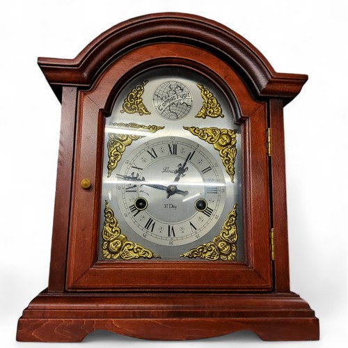 393 - A modern mahogany mantel clock, Roman numerals, twin winding holes, inscribed Lincoln, 31 Day, 36cm ... 