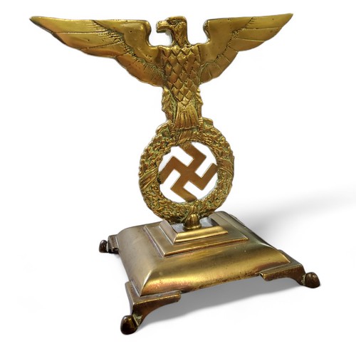 162 - A WWII German Third Reich car mascot or desk ornament mounted on a bell metal base, cast with an eag... 