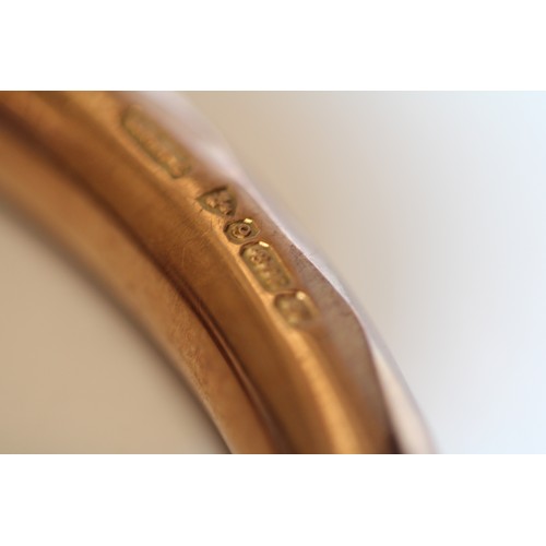 623 - A 9ct rose gold bangle, geometric pattern, H G & S, Chester, 1924, 9cms dia., William Griffiths ... 