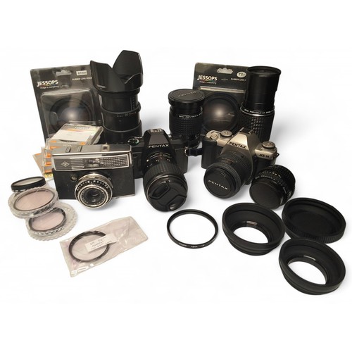 545 - A Pentax P30n 35mm SLR camera, a SMC Pentax - M Zoom 1:2:8 35mm~1:3.5 70mm lens; a Pentax MZ-M 35mm ... 