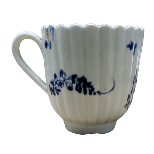 A Lowestoft fluted coffee cup, in underglaze blue with floral sprays ...