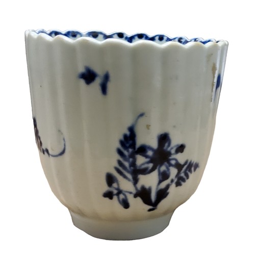 A Lowestoft fluted coffee cup, in underglaze blue with floral sprays ...