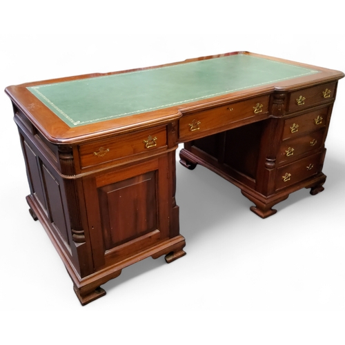 450 - A reproduction mahogany partners desk, tooled club house green leather inlaid writing surface, each ... 