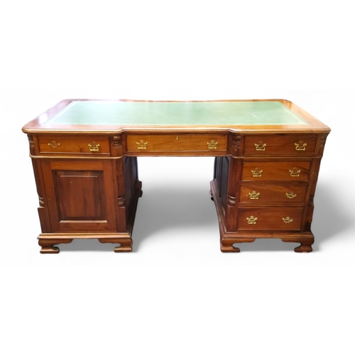 450 - A reproduction mahogany partners desk, tooled club house green leather inlaid writing surface, each ... 