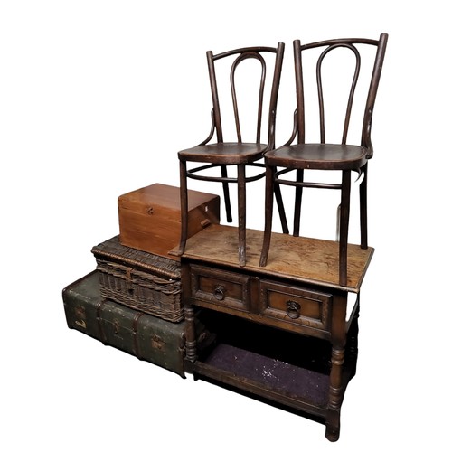 649 - An early 20th century oak hall table, two drawers to frieze, Colonial type ironwork drop loop handle... 