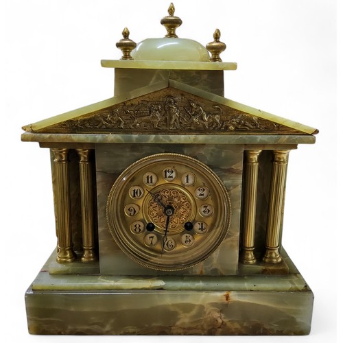 638 - An early 20th century French onyx architectural mantel clock, circular dial with Arabic numerals i, ... 