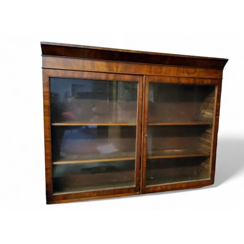 642 - A 19th century mahogany wall hanging display cabinet, moulded cornice, glazed doors enclosing adjust... 