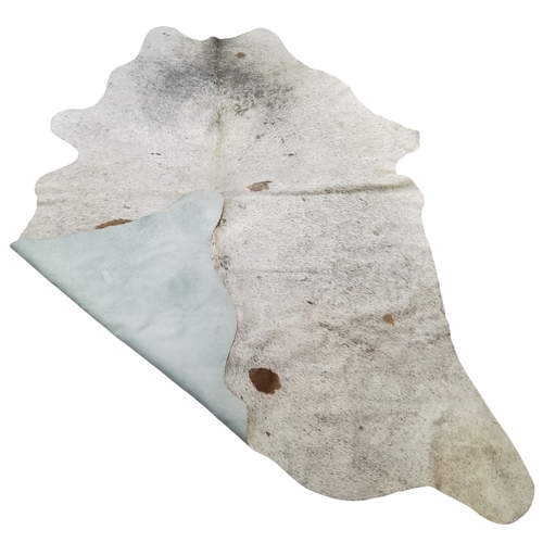 469 - A large speckled cow hide rug, 215cm x 170cm