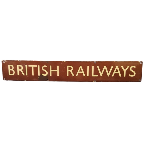 495 - Railwayana - a British Railways enamel header sign with cream text on a brown ground, 10cm x 68.5cm