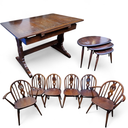 357 - An Ercol suite including four fleur-de-lys model dining chairs and two carvers; a drawer-leaf dining... 