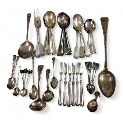 141 - Flatware -an E.P.N.S. Old English pattern serving spoon;  a caddy spoon;  a set of six pic... 