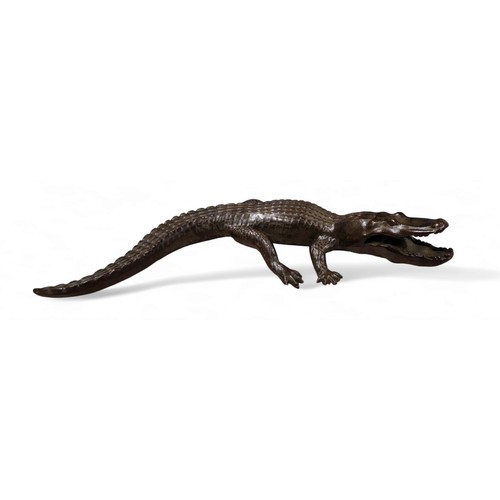 191 - Contemporary School , a dark patinated bronze of a crocodile, cast with mouth agape presenting two r... 