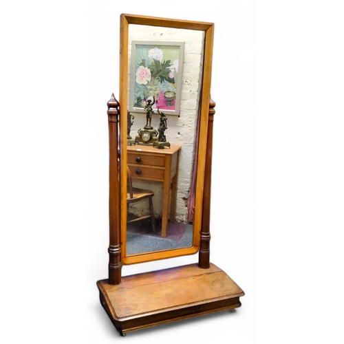 653 - A Victorian mahogany and walnut country house cheval mirror,  rectangular mirror flanked by oct... 