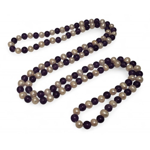 226 - An amethyst and freshwater pearl necklace, each bead approx. 8mm dia.