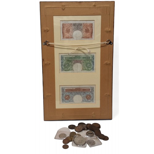 241 - A framed display of a Bank England Ten Shilling, blue and green £1 notes, each above a plaque engrav... 