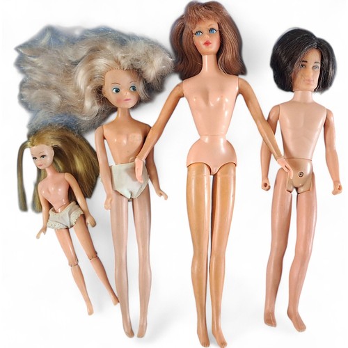 721 - A Mattel Twist 'n' Turn Barbie, bendable legs, red head, eyelashes; three other dolls inc. Hasbro c.... 