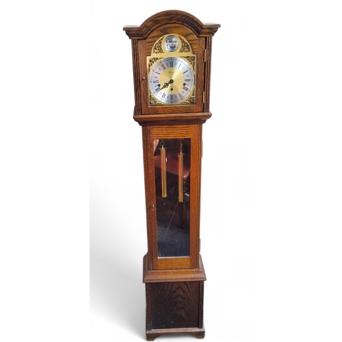 300 - A contemporary English oak Fenclocks of Suffolk grandmother clock, trio winding holes with Tempus Fu... 