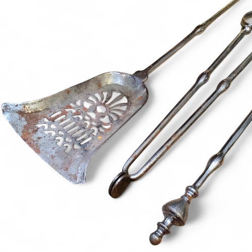 413 - A set of George III polished steel fire irons including pierced shovel, tongs and poker, each finely... 