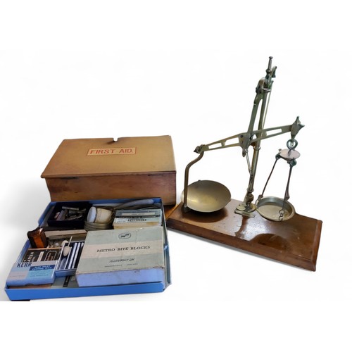 323 - A set of early 20th century brass balance scales;  a First Aid box;   other medical i... 