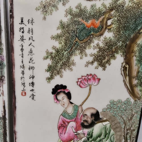 224 - A near pair of Chinese Famille Rose porcelain panels, painted with figures in a garden, script marks... 