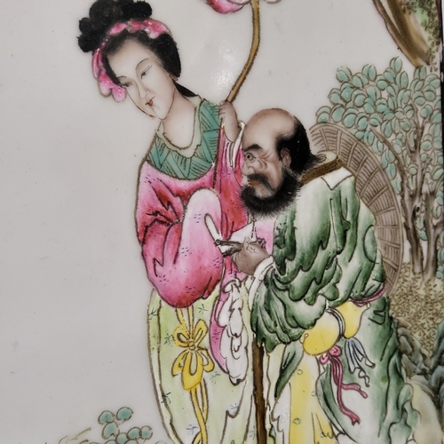 224 - A near pair of Chinese Famille Rose porcelain panels, painted with figures in a garden, script marks... 