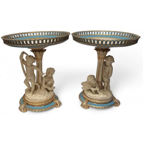 81 - A pair of mid 19th century Minton figural comports, the pierced circular dishes, banded in turquoise... 