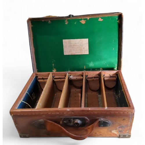 580 - Shooting Interest - a late 19th/early 20th century brass bound leather cartridge case, the inner cov... 