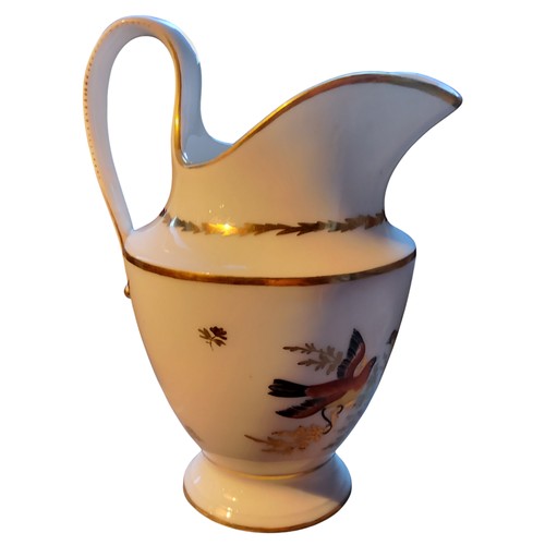 150 - An early 19th century Paris porcelain pedestal jug,  painted with fanciful birds on a gilt branch, s... 