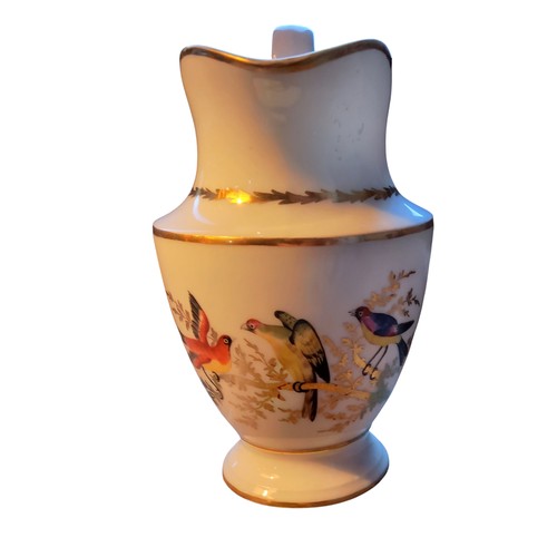 150 - An early 19th century Paris porcelain pedestal jug,  painted with fanciful birds on a gilt branch, s... 