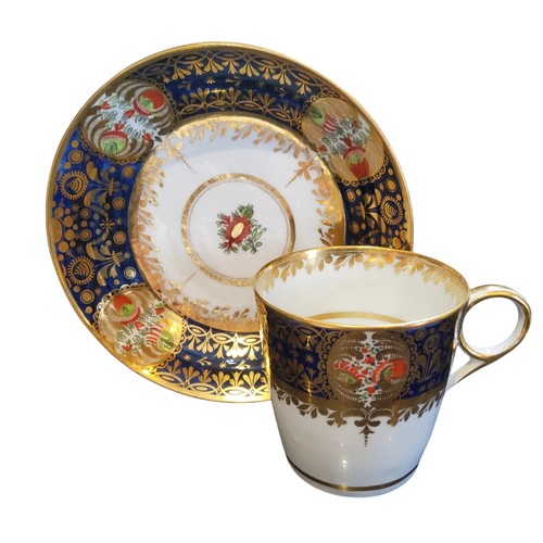 126 - A Chamberlain's coffee cup and saucer, painted with a rich blue and gilt border containing Kakiemon ... 