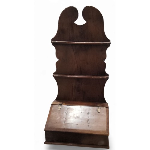 428 - An 18th century yew mural open wall hanging spoon rack, swan neck notched cresting above two rows of... 