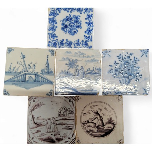 94 - 18th/19th century Dutch Delft tiles, blue and white with landscapes and figures; two others in manga... 