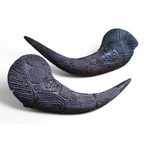 600 - Tribal Art - Grassfields Area, Cameroon, a pair of 19th century chip carved horn ceremonial drinking... 