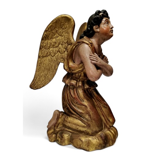 417 - An 18th century European polychrome painted and giltwood figure of an angel, looking to the gods, ar... 