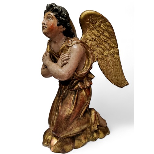 417 - An 18th century European polychrome painted and giltwood figure of an angel, looking to the gods, ar... 