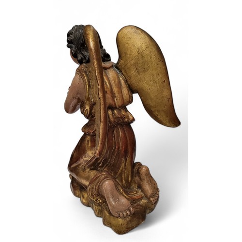 417 - An 18th century European polychrome painted and giltwood figure of an angel, looking to the gods, ar... 