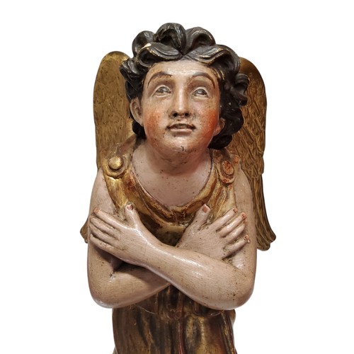 417 - An 18th century European polychrome painted and giltwood figure of an angel, looking to the gods, ar... 