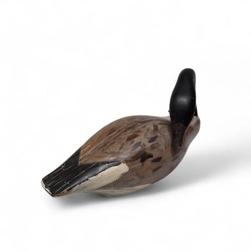 335 - A Canada goose decoy, naturalisticaly carved and painted in the manner of Guy Taplin