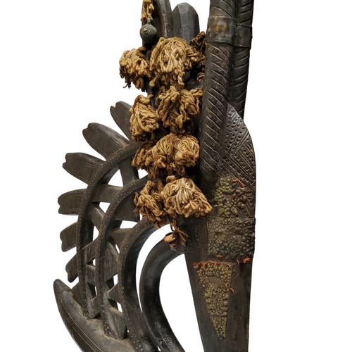 452 - An early 20th century metal adorned African Mali Tji Wara Bambara tribe headdress, modelled as a mal... 