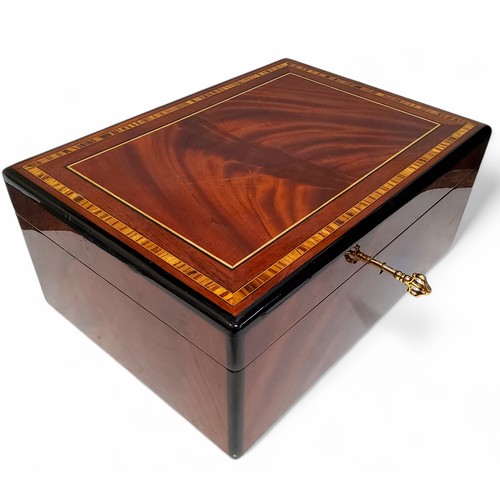 385 - A Sheraton Revival flamed mahogany and cross banded humidor, with a fitted interior, 13cm x 31cm x 2... 