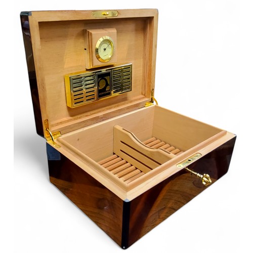 385 - A Sheraton Revival flamed mahogany and cross banded humidor, with a fitted interior, 13cm x 31cm x 2... 